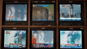 Television screens show coverage of the Sept. 11 attacks in a scene from Showtime’s “The Loudest Voice.” (Showtime)