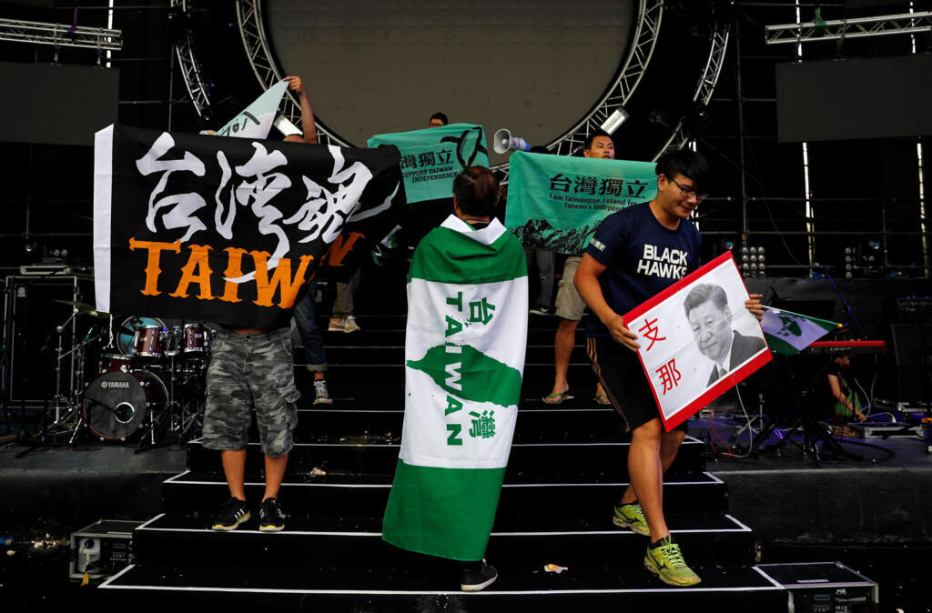 Students wave so-called Taiwanese independence flags to protest against a popular Chinese talent show at National Taiwan University, Taipei, Taiwan.