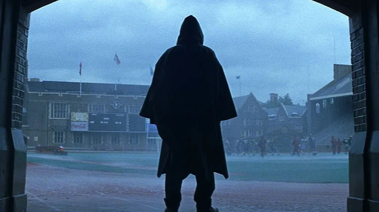 David Dunn (Bruce Willis) looks at pouring rain on a football field in Unbreakable