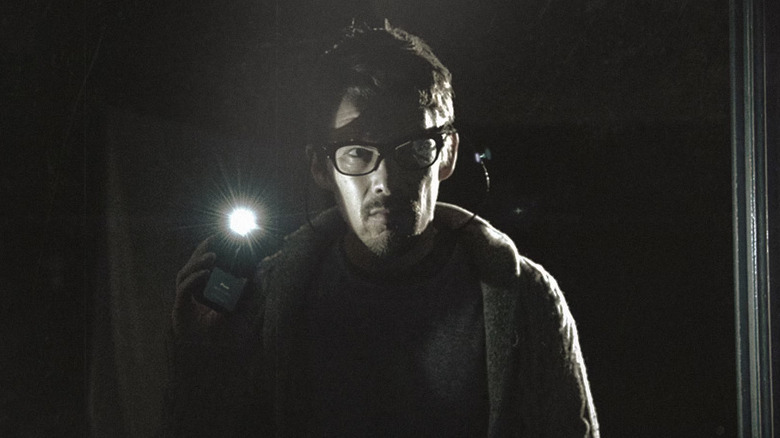 A distraught Ellison Oswalt (Ethan Hawke) stares emotionally ahead in Sinister
