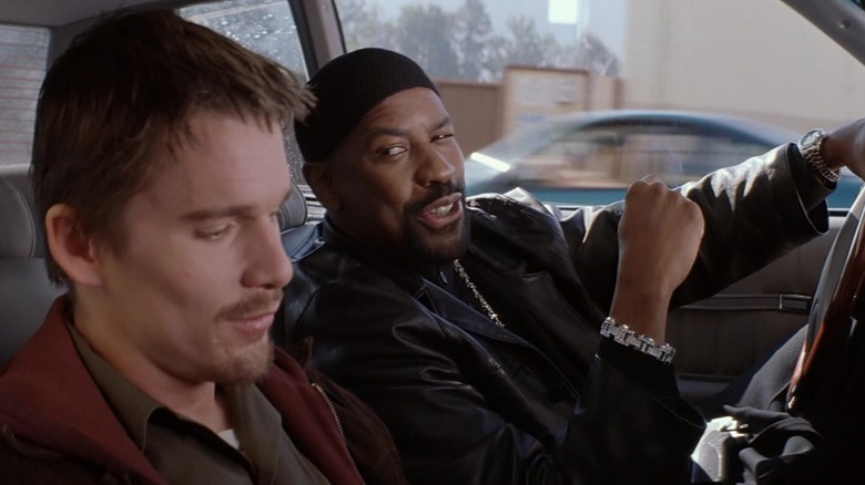 Denzel Washington's Detective Alonzo Harris sits with Ethan Hawke's Jake Hoyt in Training Day