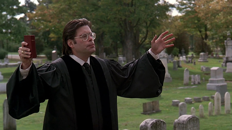Stephen King plays a minister in a scene from Pet Sematary (1989)