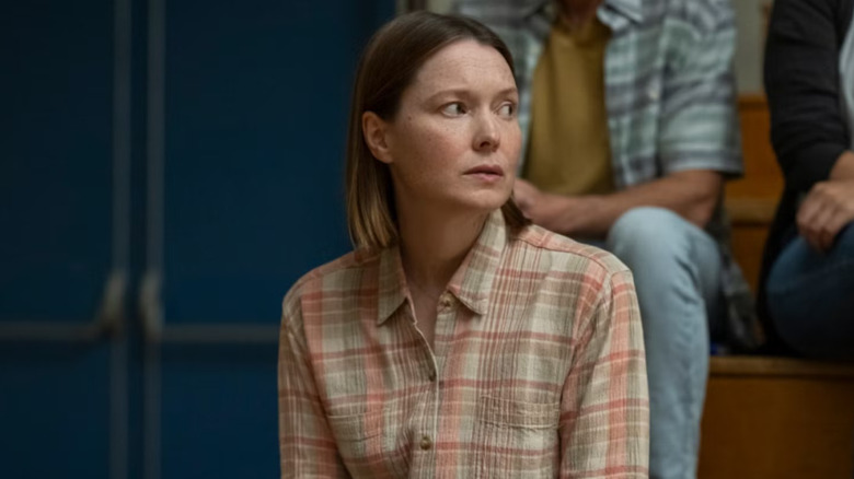 Margaret White sitting on bleachers in Carrie
