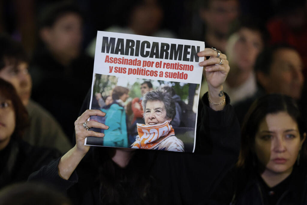 Protesters hold a picture of Maricarmen Abascal, the 87-year-old pensioner whose eviction triggered nationwide protests over Spain's chronic housing crisis, after her death on 7 October 2026.