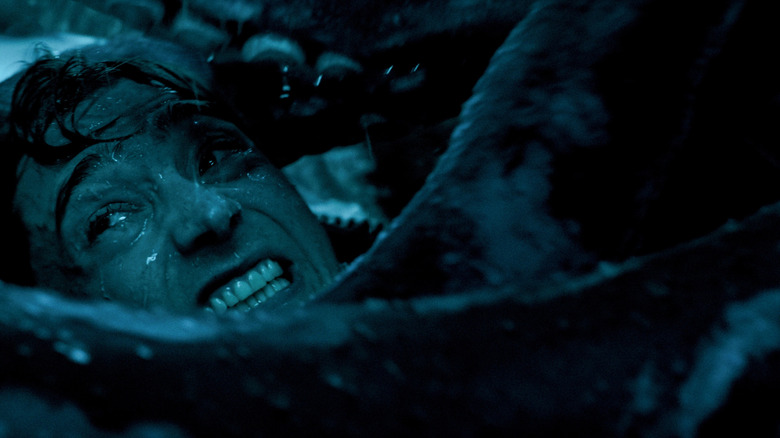 Austin Abrams as Jay Gardiner attacked by the tentacles of a giant squid in Whalefall