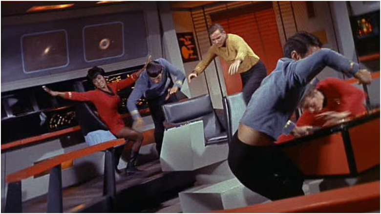 The bridge of the Enteerprise lurching about with everyone flying every which-way on Star Trek