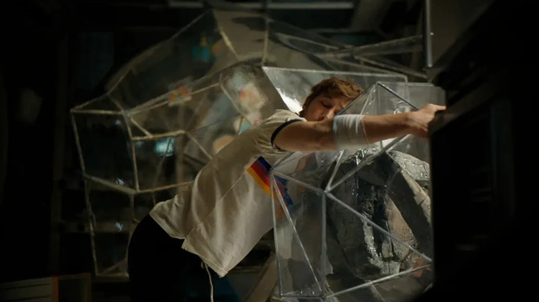Ryan Gosling as Ryland Grace hugging Rocky in his ball in Project Hail Mary